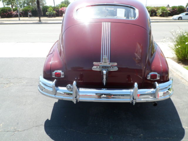1946 Burgundy Pontiac Streamliner Sedan