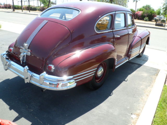 1946 Burgundy Pontiac Streamliner Sedan