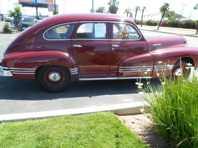 1946 Burgundy Pontiac Streamliner Sedan