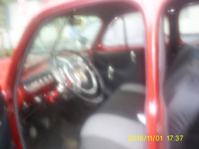 1947 Candy Apple Red Metalic Ford Delux 4 door