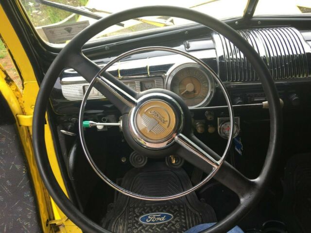 1948 Yellow Ford Deluxe Coupe Coupe