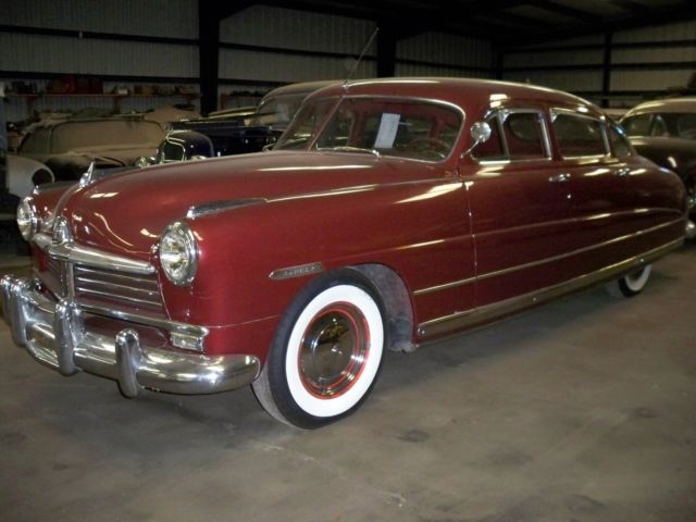 1948 Burgundy Ford COMMODORE Sedan
