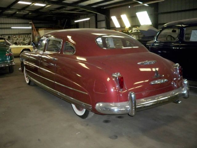 1948 Burgundy Ford COMMODORE Sedan