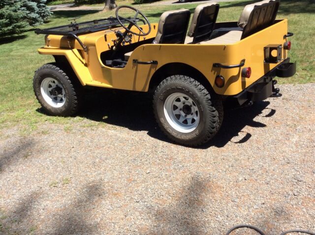 1949 Yellow Willys Jeep SUV