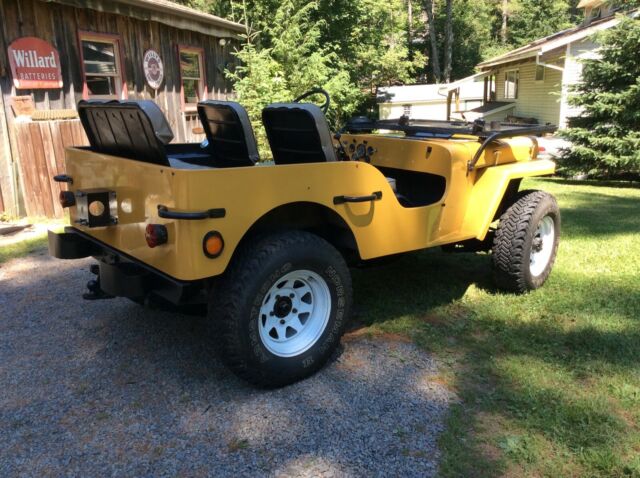 1949 Yellow Willys Jeep SUV