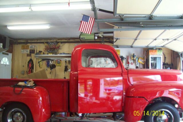 1950 red Ford F-100 Standard Cab Pickup