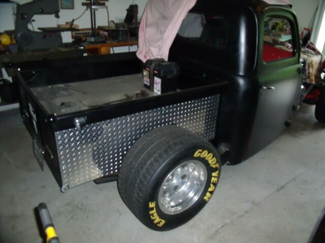 1951 black and red Ford F-100 Standard Cab Pickup