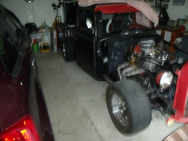 1951 black and red Ford F-100 Standard Cab Pickup