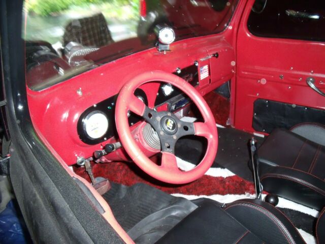1951 black and red Ford F-100 Standard Cab Pickup