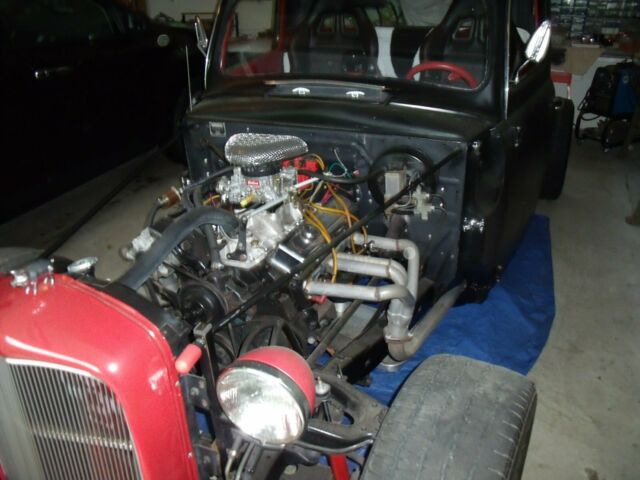 1951 black and red Ford F-100 Standard Cab Pickup