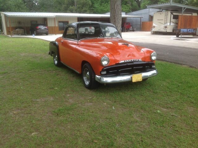 1951 Orange and Black Plymouth Voyager Coupe