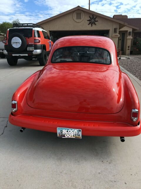 1954 Orange Chevrolet 350ci with air Sedan