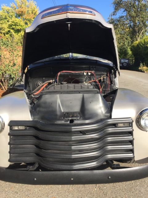 1953 Grey and silver Chevrolet Suburban SUV