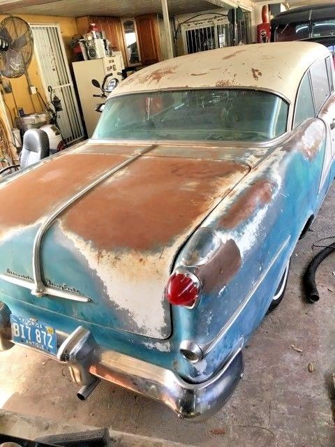 1954 blue and white Oldsmobile Ninety-Eight Coupe