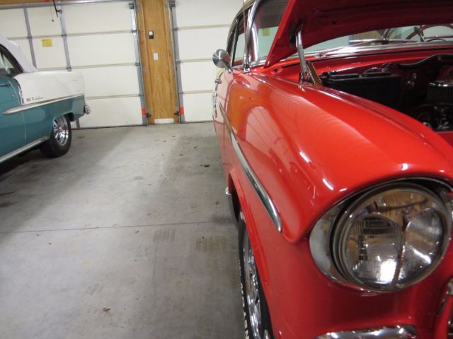 1955 red  and white Chevrolet Bel Air/150/210 Coupe
