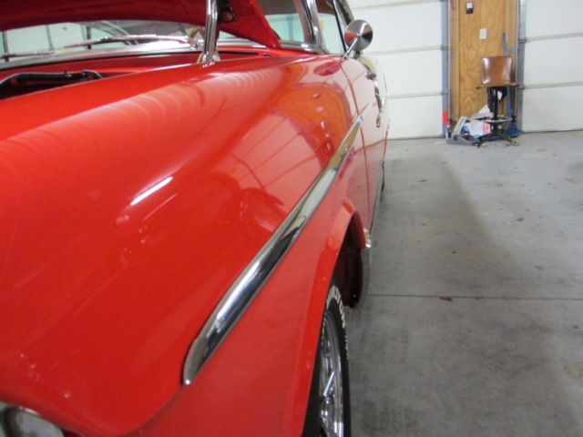 1955 red  and white Chevrolet Bel Air/150/210 Coupe