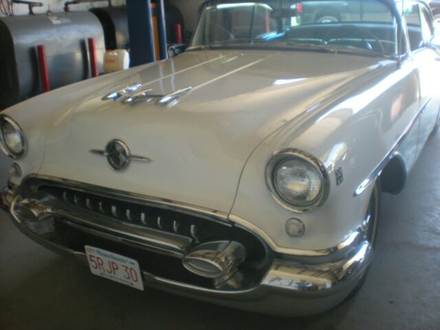 1955 turquise/white Oldsmobile Eighty-Eight Coupe