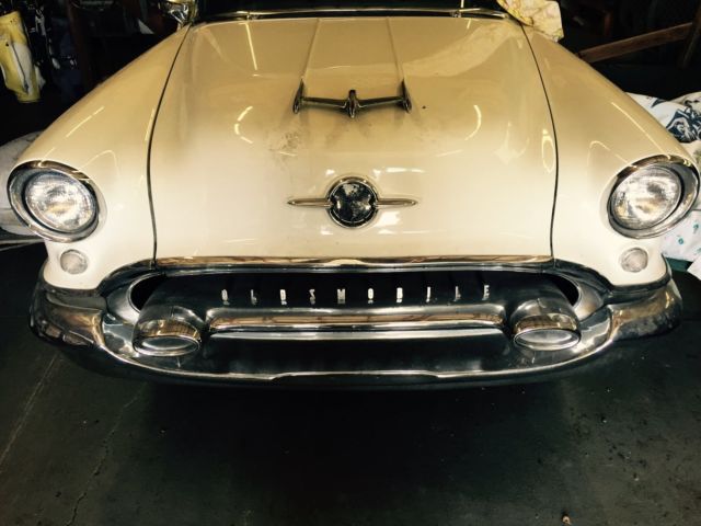 1955 White with pink marbled scallops and blue accents Oldsmobile Eighty-Eight Coupe