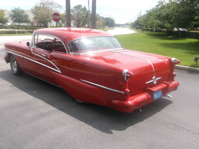 1955 Red Oldsmobile Ninety-Eight Coupe