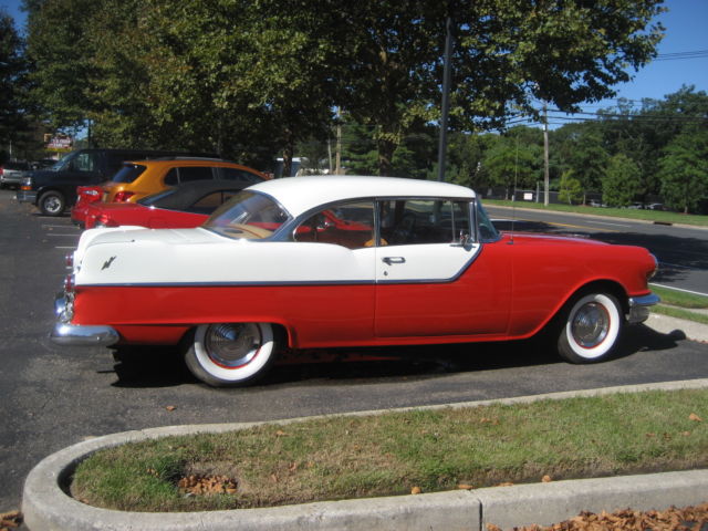 1955 red and white Pontiac Chieftain hardtop