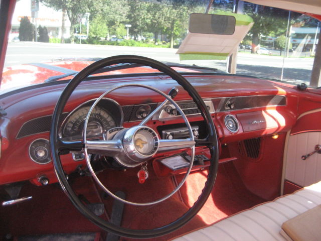 1955 red and white Pontiac Chieftain hardtop