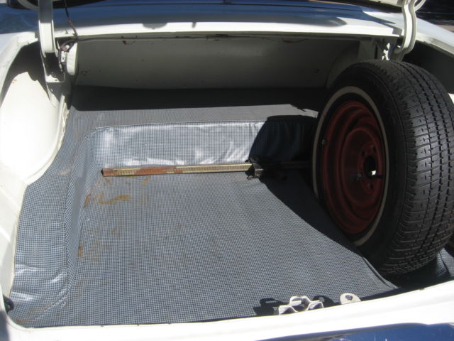 1955 red and white Pontiac Chieftain hardtop