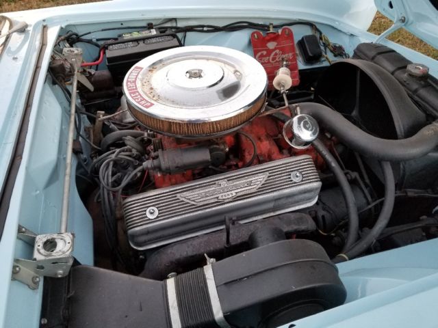 1955 baby blue Ford Thunderbird 2 door conv