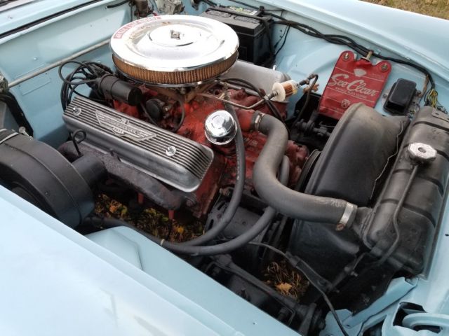 1955 baby blue Ford Thunderbird 2 door conv