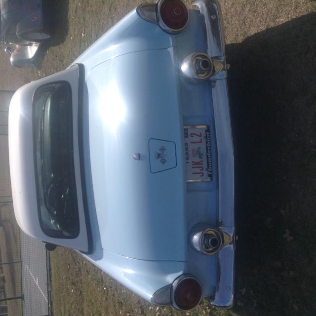 1955 baby blue Ford Thunderbird 2 door conv
