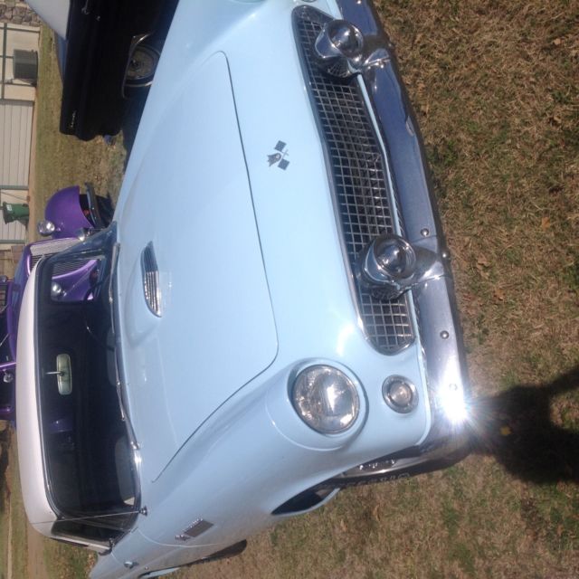 1955 baby blue Ford Thunderbird 2 door conv