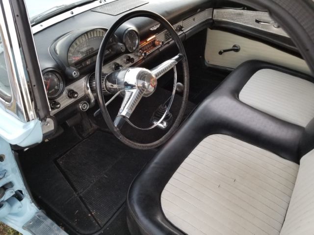 1955 baby blue Ford Thunderbird 2 door conv