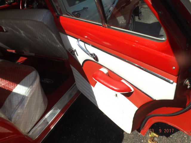 1956 Red/White Ford Fairlane Four door post