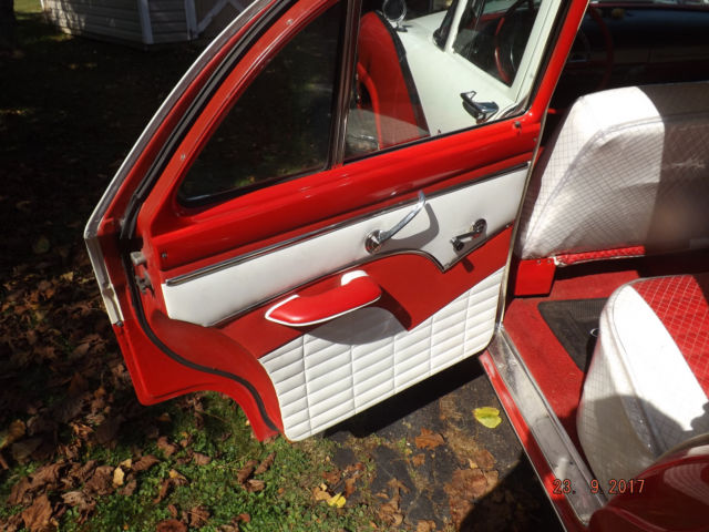 1956 Red/White Ford Fairlane Four door post