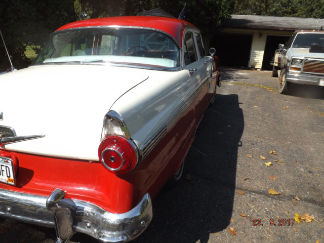 1956 Red/White Ford Fairlane Four door post
