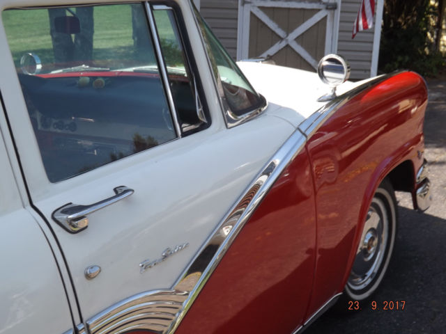 1956 Red/White Ford Fairlane Four door post