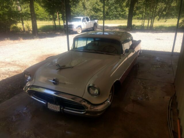 1956 Red Oldsmobile Eighty-Eight Coupe