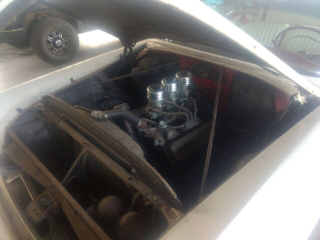 1956 Red Oldsmobile Eighty-Eight Coupe