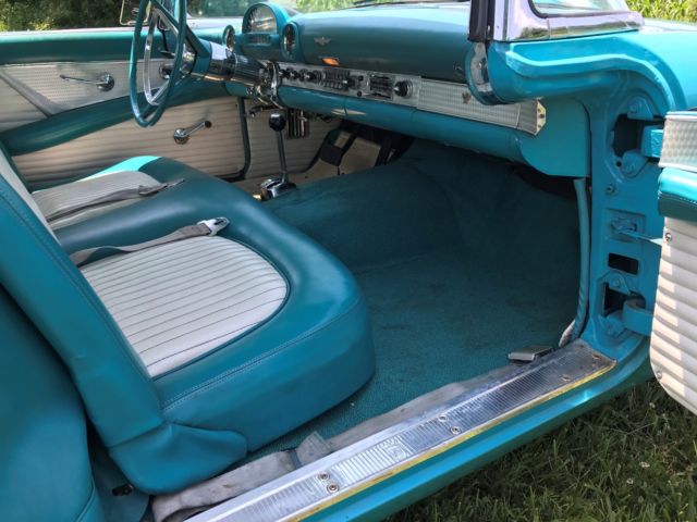 1956 Turquise Ford Thunderbird 2 door roadster.