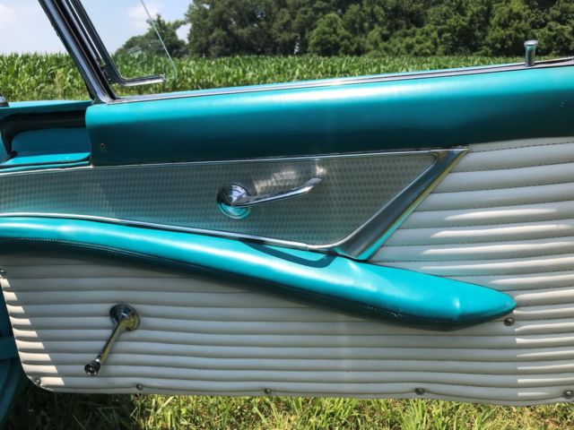 1956 Turquise Ford Thunderbird 2 door roadster.