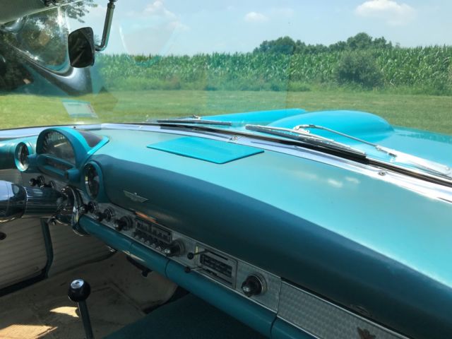 1956 Turquise Ford Thunderbird 2 door roadster.