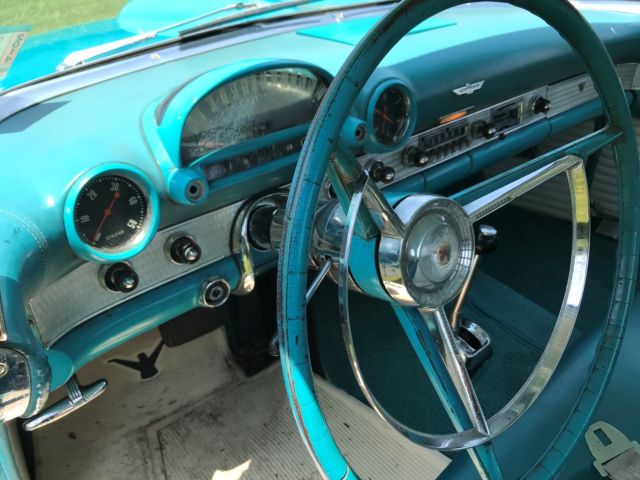 1956 Turquise Ford Thunderbird 2 door roadster.