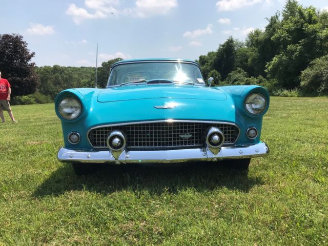 1956 Turquise Ford Thunderbird 2 door roadster.