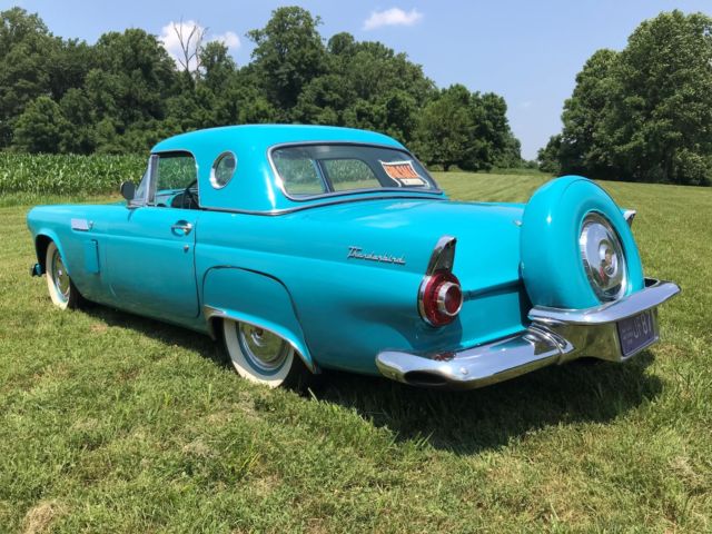1956 Turquise Ford Thunderbird 2 door roadster.