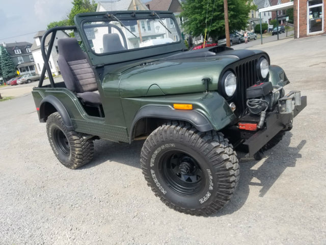 1956 forest green metallic Willys jeep Convertible