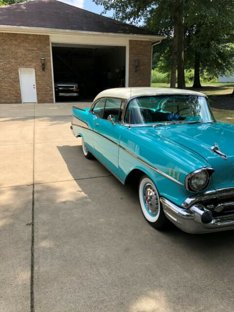 1957 Tropical Turquoise/India Ivory Chevrolet Bel Air/150/210 Coupe