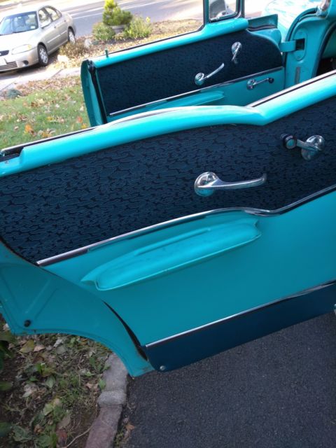 1957 turquoise-blue & white Chevrolet Bel Air/150/210 coupe sport 4 dr