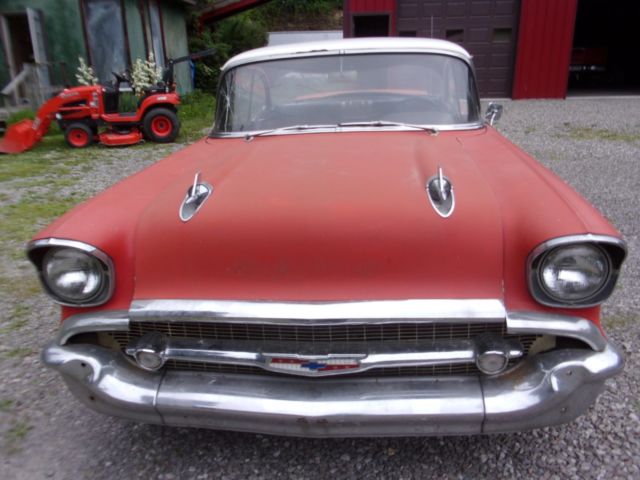 1957 red Chevrolet Bel Air/150/210 2 door ht