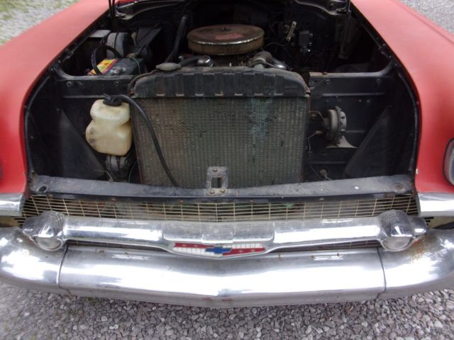 1957 red Chevrolet Bel Air/150/210 2 door ht
