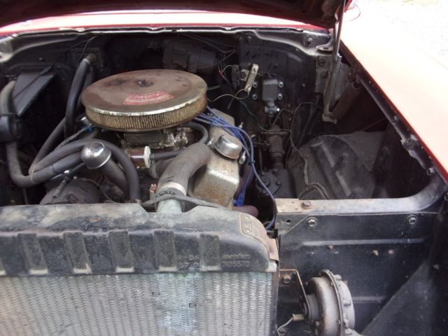1957 red Chevrolet Bel Air/150/210 2 door ht