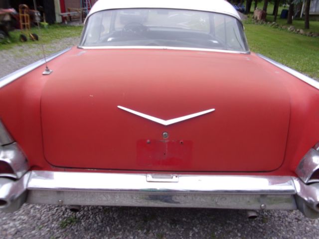1957 red Chevrolet Bel Air/150/210 2 door ht